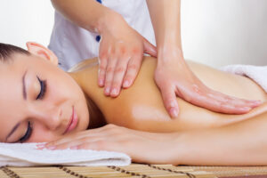 Beautiful woman getting a massage in the spa salon